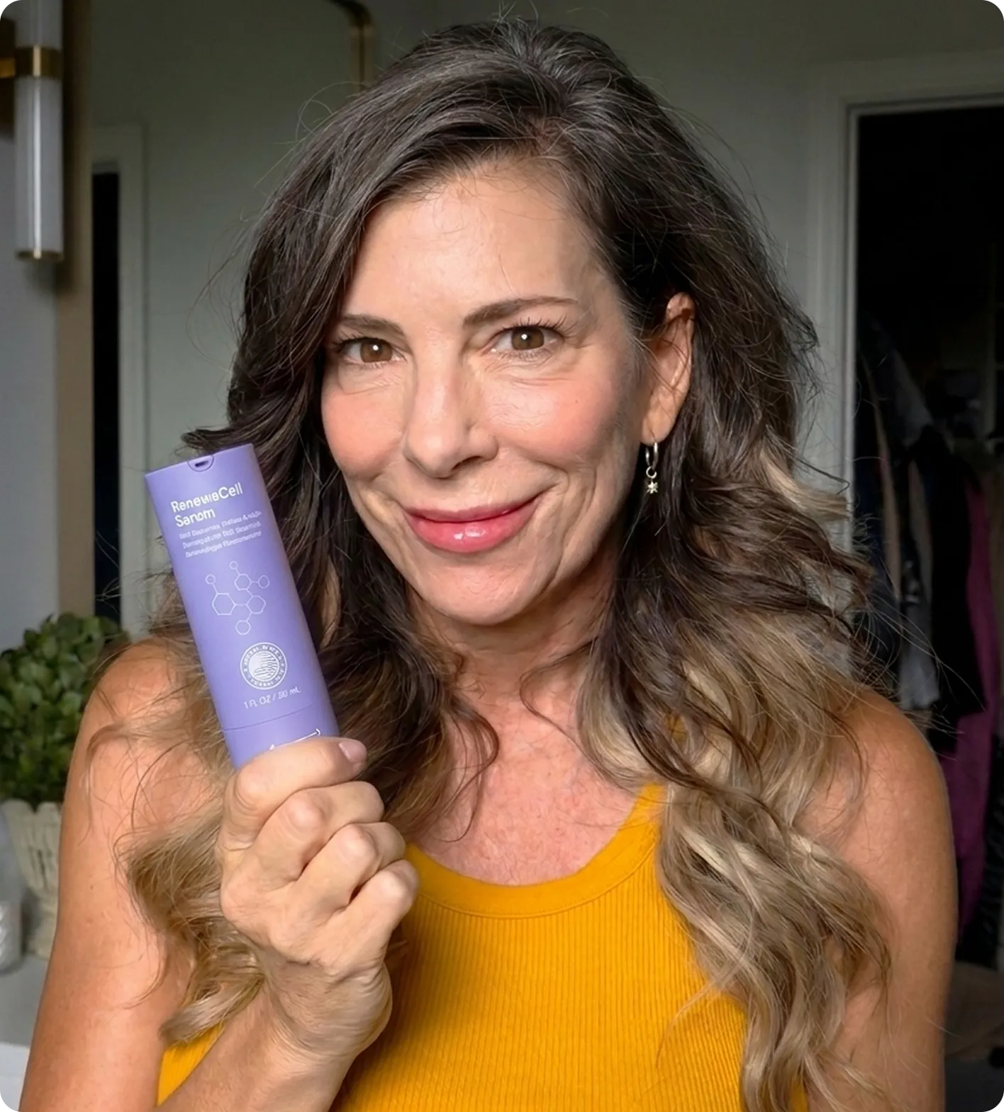 Woman holding RenewaCell Serum
