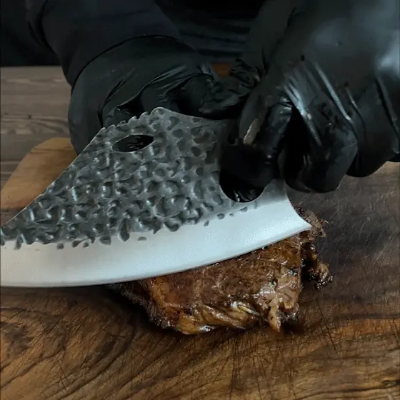 Gator cutting brisket like butter